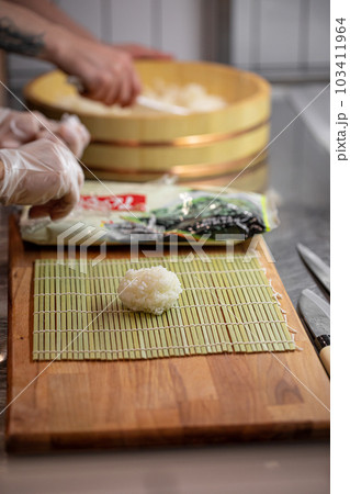 Sushi Chef Making Roll Sushi With Cucumber And Egg Stock Photo, Picture and  Royalty Free Image. Image 131623657.