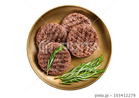 Grilled burger beef meat patty with herbs and spices on steel plate. Isolated on white background. 103412279