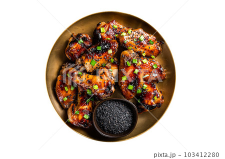 Teriyaki chicken wings with black sesame in a plate. Isolated on white background. 103412280