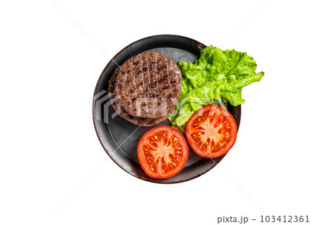 Tasty grilled burger beef patty with tomato, spices and lettuce in kitchen tray. Isolated on white background. Tasty grilled burger beef patty with tomato, spices and lettuce in kitchen tray. Isolated on white background. 103412361