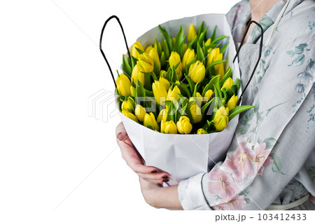 Girl florist holding a bunch of yellow tulips. Floristic. Isolated on white background Girl florist holding a bunch of yellow tulips. Floristic. Isolated on white background 103412433
