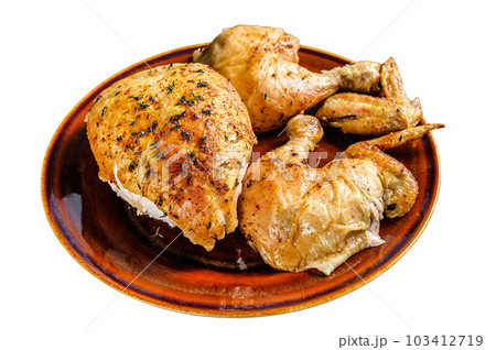 Butchered baked chicken on wooden table. Isolated on white background. 103412719