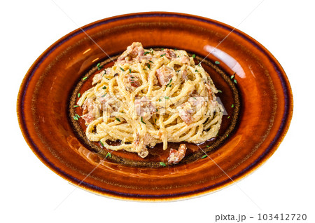 Italian Spaghetti Carbonara pasta with bacon, hard parmesan cheese and cream sauce. Isolated on white background. 103412720