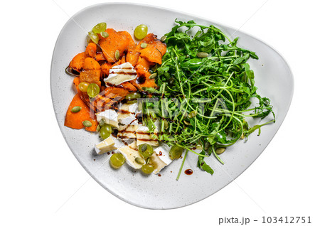 Grilled pumpking warm salad with arugula, walnuts and brie cheese. Isolated on white background. Grilled pumpking warm salad with arugula, walnuts and brie cheese. Isolated on white background. 103412751