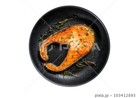 Grilled salmon steak in a pan. Isolated on white background. 103412893