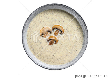 Champignon Mushroom cream soup in a plate. Isolated on white background. Champignon Mushroom cream soup in a plate. Isolated on white background. 103412917