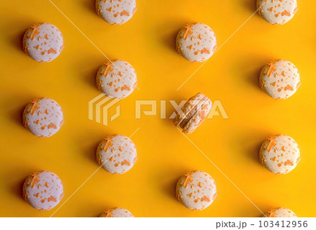 pattern of almond macaroons on a bright yellow background pattern of almond macaroons on a bright yellow background 103412956
