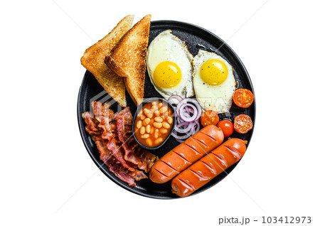 English breakfast with fried eggs, sausages, bacon, beans and toasts in a plate. Isolated on white background. 103412973