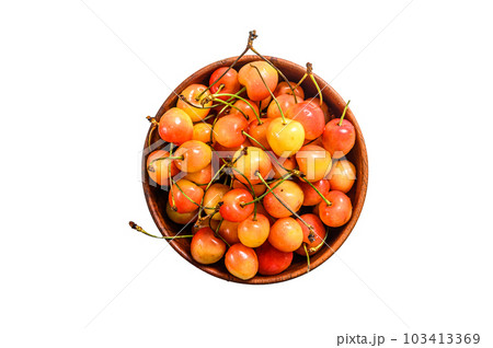Mix of yellow and red ripe cherries in a bowl. Isolated on white background. 103413369