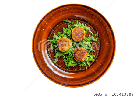 Roasted chickpeas falafel patties with arugula on a plate. Isolated on white background. 103413585