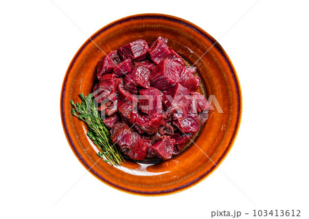 Raw diced deer steak for a venison goulash. Isolated on white background. 103413612