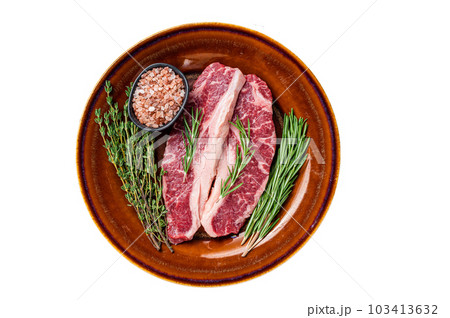Two sliced Raw Striploin steaks or New York steaks, beef meat. Isolated on white background. 103413632