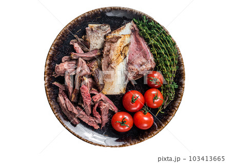 Smoked beef short ribs in rustic plate with herbs. Isolated on white background Smoked beef short ribs in rustic plate with herbs. Isolated on white background 103413665