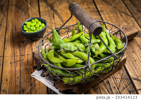 Edamame green Beans, fresh soy beans. Wooden background. Top view 103414123