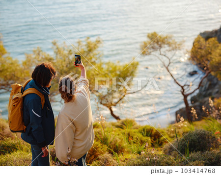 trip to Turkey, girlfriends enjoy sunset over Fethiye city 103414768