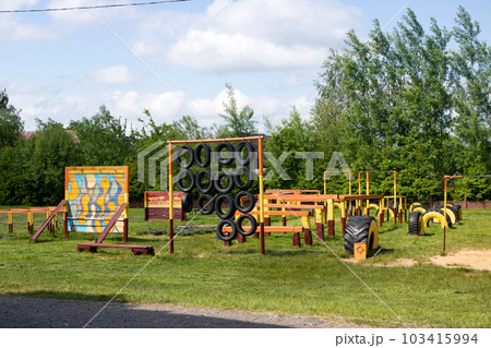 Children's sports equipment in yard on grass Children's sports equipment in yard on grass 103415994