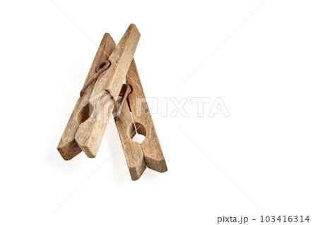 Two aged vintage wooden clothespin isolated on white background Two aged vintage wooden clothespin isolated on white background 103416314