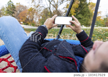 Man using smartphone. Blank white screen for copy space Man using smartphone. Blank white screen for copy space 103417029