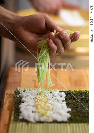 Sushi Chef Making Roll Sushi With Cucumber And Egg Stock Photo, Picture and  Royalty Free Image. Image 131623657.