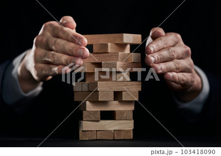 Businessman Building The Success,plan and strategy in business,risk concept. Businessman Building The Success,plan and strategy in business,risk concept. 103418090