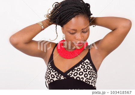 Portrait of a beautiful woman with hands on her neck. 103418567