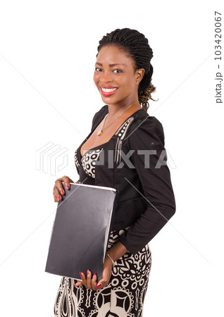 Young businesswoman standing holding a folder. Young businesswoman standing holding a folder. 103420067