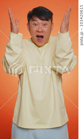 Excited amazed man showing head explosion, looking worried shocked surprised guy, wow idea eureka Excited amazed man showing head explosion, looking worried shocked surprised guy, wow idea eureka 103420615