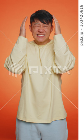 Handsome chinese man loses becoming surprised by lottery results, bad fortune, loss, unlucky news Handsome chinese man loses becoming surprised by lottery results, bad fortune, loss, unlucky news 103420616