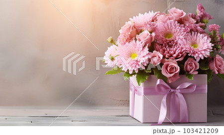 Beautiful bouquet of rose and chrysanthemums flowers and pink gift box on brick wall background. 103421209
