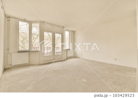 an empty room with white walls and no one person standing in the doorway or window looking out to the street an empty room with white walls and no one person standing in the doorway or window looking out to the street 103429523