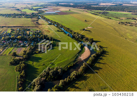 Agricultural fields along the river in the countryside Agricultural fields along the river in the countryside 103430218