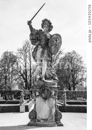 Statue of Christian Warrior by Matthias Braun in Herbal gardens of Kuks baroque hospital complex on sunny summer day, Czech Republic. Black and white photography. 103430256