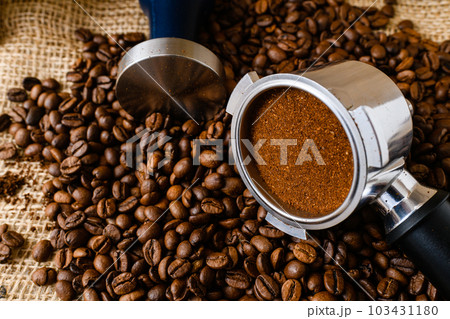 Ground coffee with tamper, holder and beans Ground coffee with tamper, holder and beans 103431180