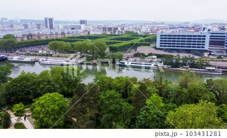 New cemetery of Boulogne  in left part and river  Seine  and some  buildings in panorama of Paris in May. Photo from park Saint-Germain island park 103431281