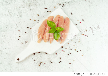 Raw fresh chicken fillet on a gray background with fresh herbs.Copy space.Food for retail.Ogranic food,healthy eating.Food concept.Top view.Chicken breast Fillets.Close up.Raw chicken meat. 103431937