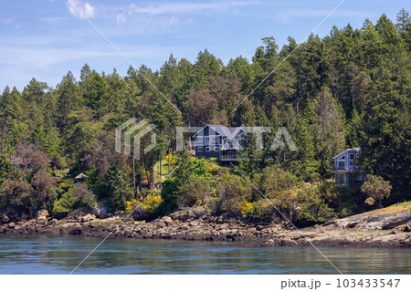 Cabin on a Rocky Shore on the West Coast of Pacific Ocean. Canadian Nature Background. Cabin on a Rocky Shore on the West Coast of Pacific Ocean. Canadian Nature Background. 103433547