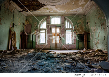 Collapsed stucco from the ceiling in the room of an old abandoned manor 103434673