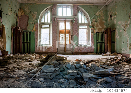 Collapsed stucco from the ceiling in the room of an old abandoned manor Collapsed stucco from the ceiling in the room of an old abandoned manor 103434674