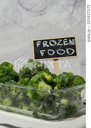 Frozen food broccoli florets with blackboard label and text FROZEN FOOD homemade. Harvesting concept. Stocking up vegetables for winter storage. Healthy food 103437272