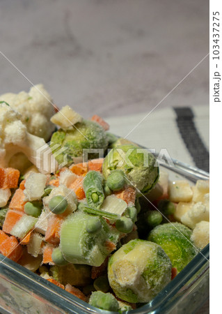 Frozen mixed vegetables for long-term storage. Deep freezing of vegetables. defrosting Frozen food background Frozen mixed vegetables for long-term storage. Deep freezing of vegetables. defrosting Frozen food background 103437275