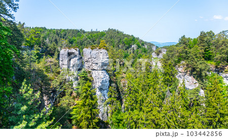 Panoramic view of a sandstone rock city in Bohemian Paradise, Czech: Cesky raj. Rock climbers on top of a rocky tower. Czech Republic Panoramic view of a sandstone rock city in Bohemian Paradise, Czech: Cesky raj. Rock climbers on top of a rocky tower. Czech Republic 103442856