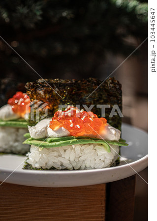 Japanese hand rolls with caviar and avocado 103445647