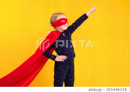 Superhero little girl in a red raincoat and a mask Superhero little girl in a red raincoat and a mask 103446159