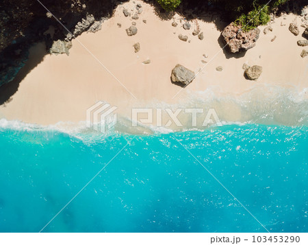 Aerial view of beach with stones and turquoise ocean in Hawaii Aerial view of beach with stones and turquoise ocean in Hawaii 103453290