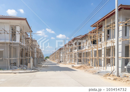 construction residential new house in progress at building site housing estate development construction residential new house in progress at building site housing estate development 103454732