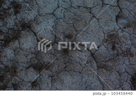 Dark gray background with cracks and hollows Dark gray background with cracks and hollows 103458440
