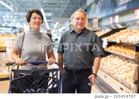 couple chooses sweet puffs in bakery couple chooses sweet puffs in bakery 103459707