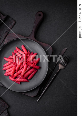 Delicious penne pasta with beets, cheese, salt and spices Delicious penne pasta with beets, cheese, salt and spices 103461019