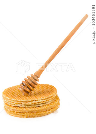 Honey dipper and waffles isolated on white . Vertical photo. 103461591