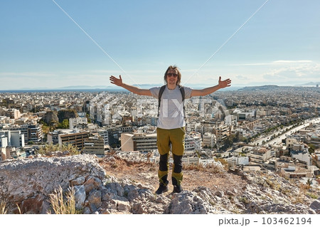 City view of Athens, Greece, tourist posing on hill City view of Athens, Greece, tourist posing on hill 103462194